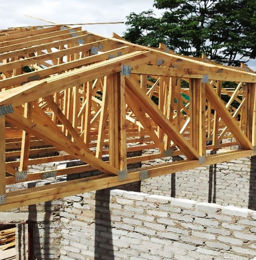 Close-up of prefabricated trusses sitting on blockwork walls